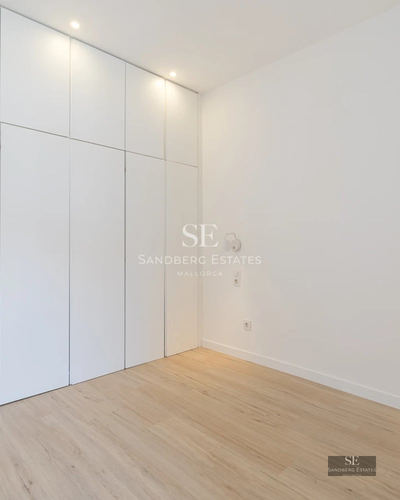 View of infinity pool with lush garden and modern architecture. Elegant interior with natural light and panoramic views.