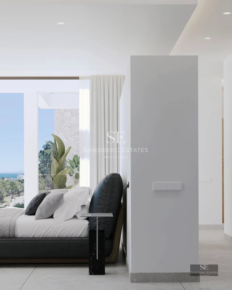 Spacious living room featuring floor-to-ceiling windows, sea views, and modern furniture. Bright and elegant interior.