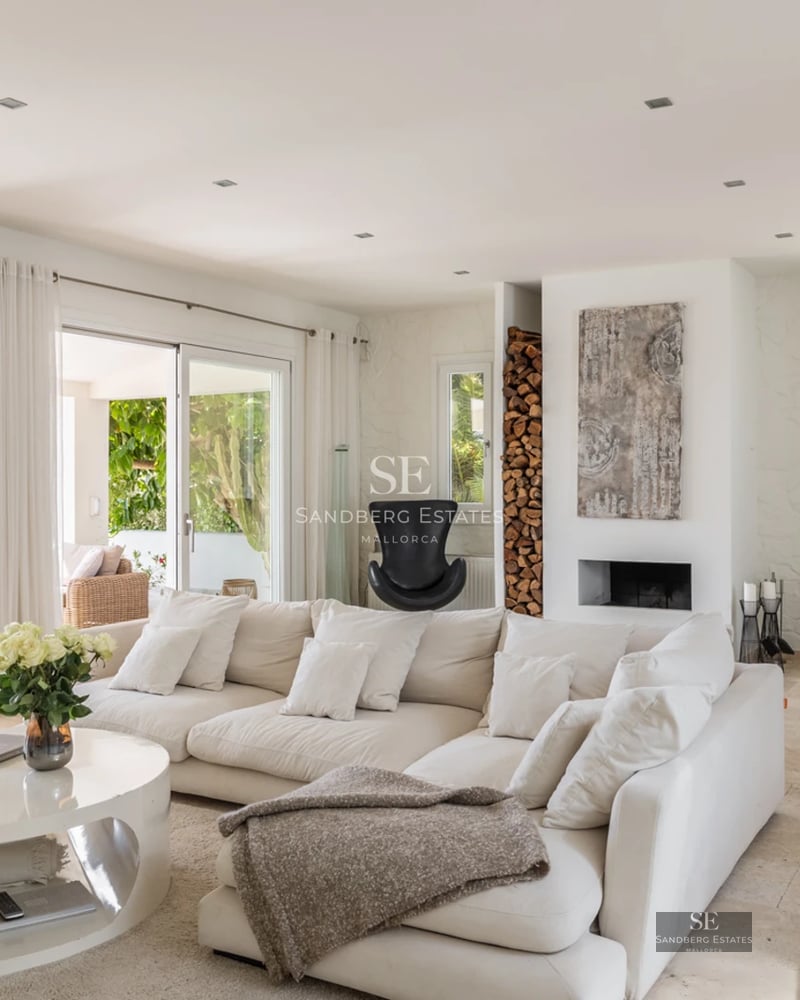 Spacious balcony with panoramic sea views. Modern design, glass railing, and elegant outdoor furniture.