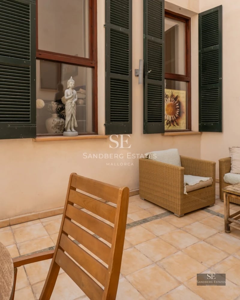 Exterior view of modern villa featuring an infinity pool and large windows. Minimalist design, well-maintained garden.