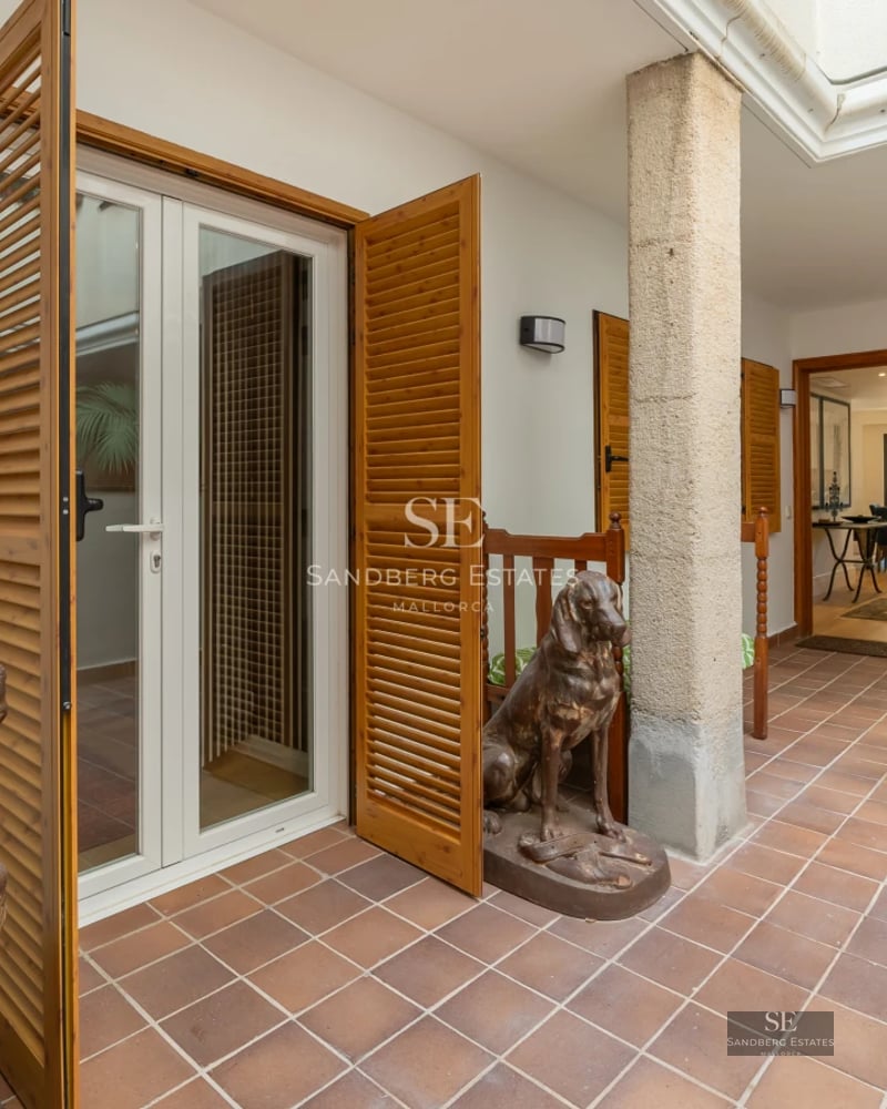 Panoramic view of a modern villa with infinity pool, lush garden, and elegant architectural design.