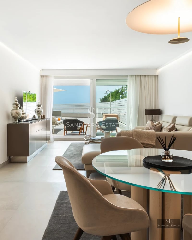 Pool view, lush garden, modern design. Large windows illuminate the property. High-quality materials and finishes throughout.