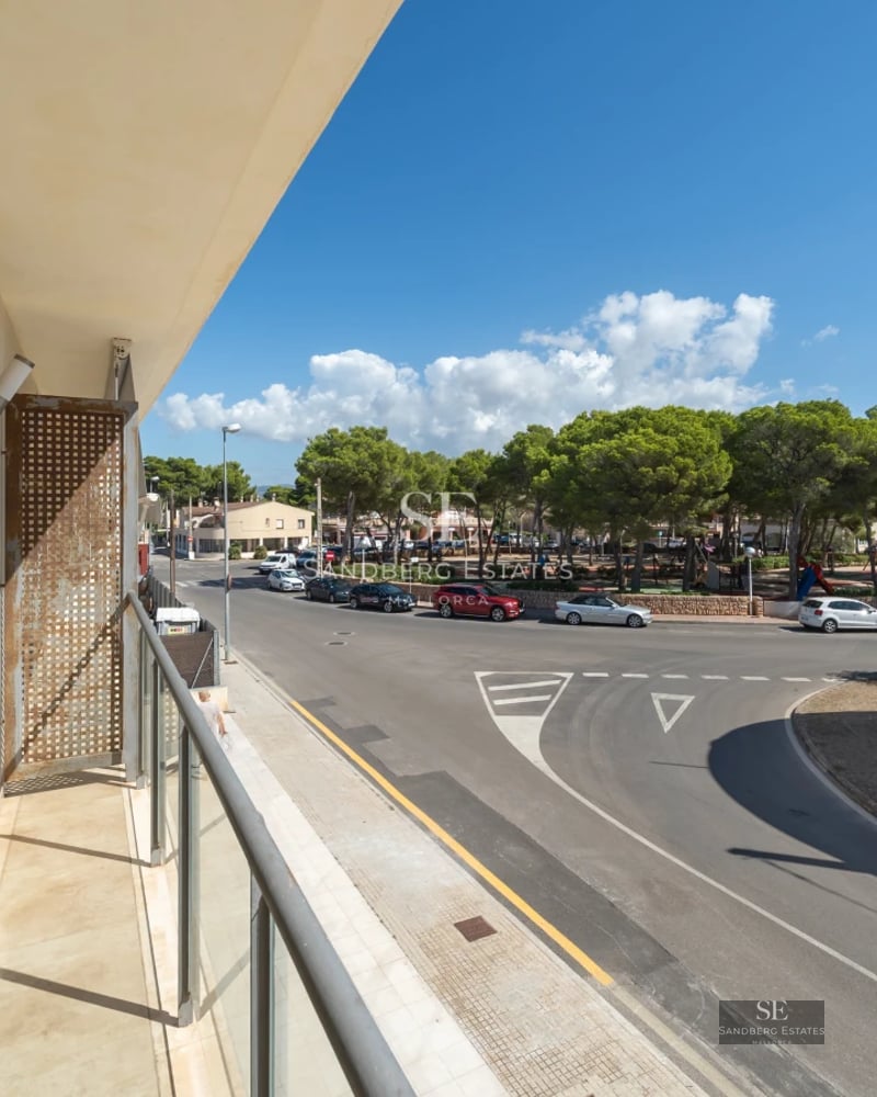 Expansive terrace with infinity pool, ocean views, and modern furniture. Minimalist, elegant design. Ambient lighting.