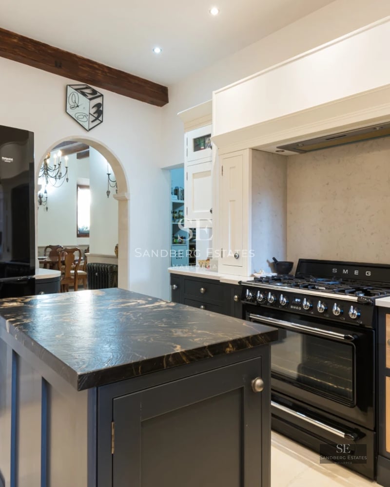 Aerial view of a modern house with pool, garden, and expansive terraces. Minimalist design with large windows and high-quality finishes.