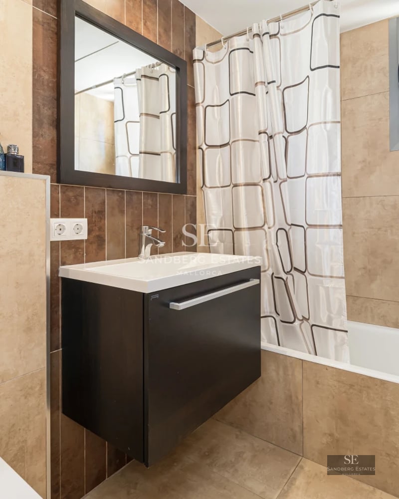 Exterior view of a modern villa with infinity pool, large windows, and lush landscaping. Contemporary architecture.