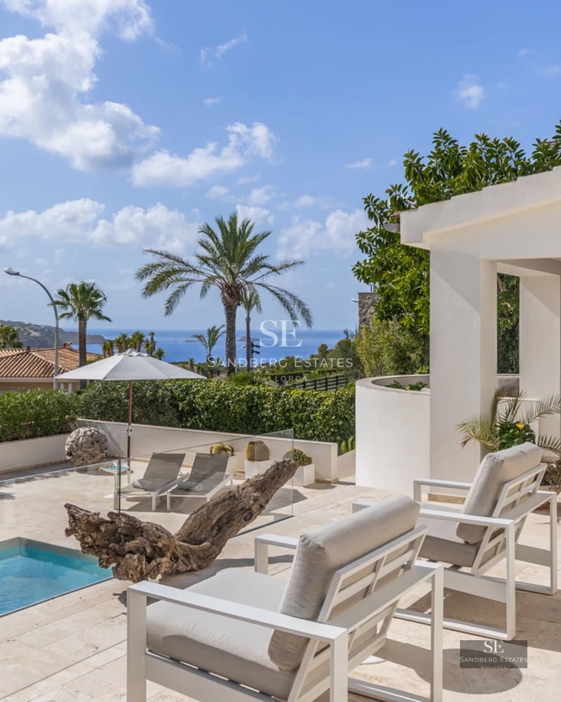 Exterior view of a modern villa with a pool. Minimalist architecture, large windows, terrace, and garden. Contemporary design.