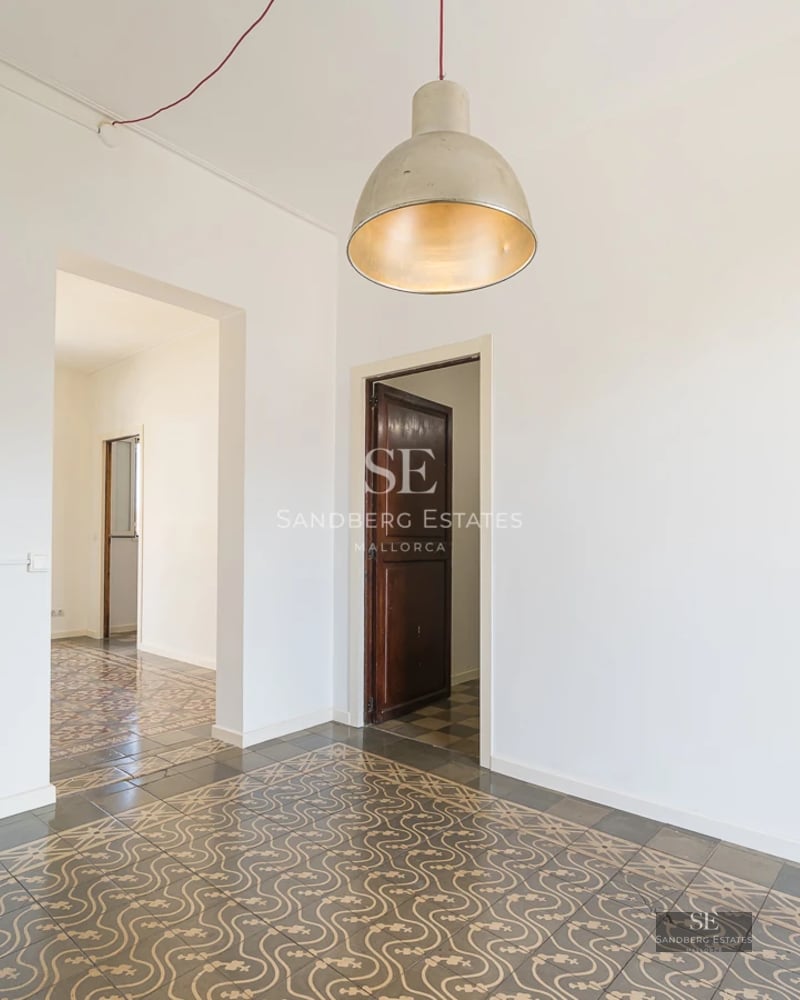 Exterior view of a modern villa featuring a pool, lush garden, and spacious terraces. Minimalist architecture with large windows.