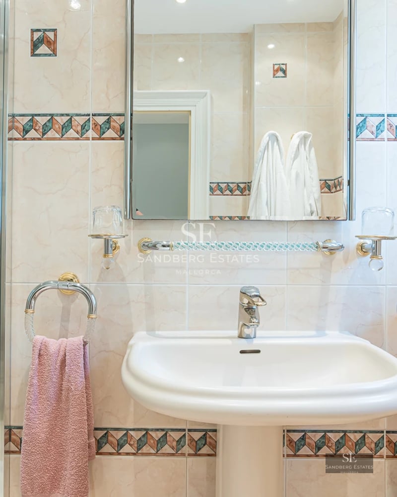 Exterior view of a modern villa with a pool, surrounded by greenery and minimalist architectural design. Natural lighting.