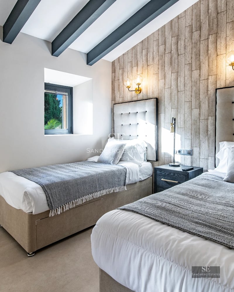 Exterior view of a modern villa with infinity pool, lush garden, and spacious terraces. Minimalist architecture with clean lines.