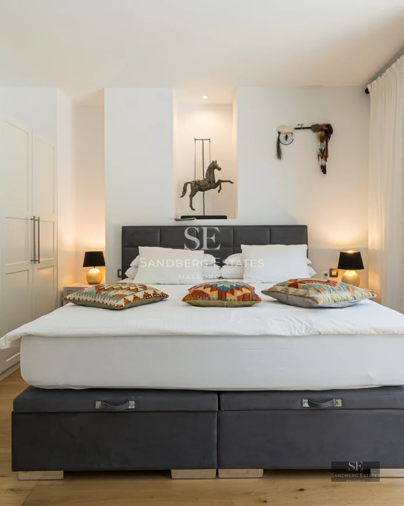 Exterior view of a modern villa featuring a pool, lush garden, and expansive terraces. Minimalist architecture with large windows.