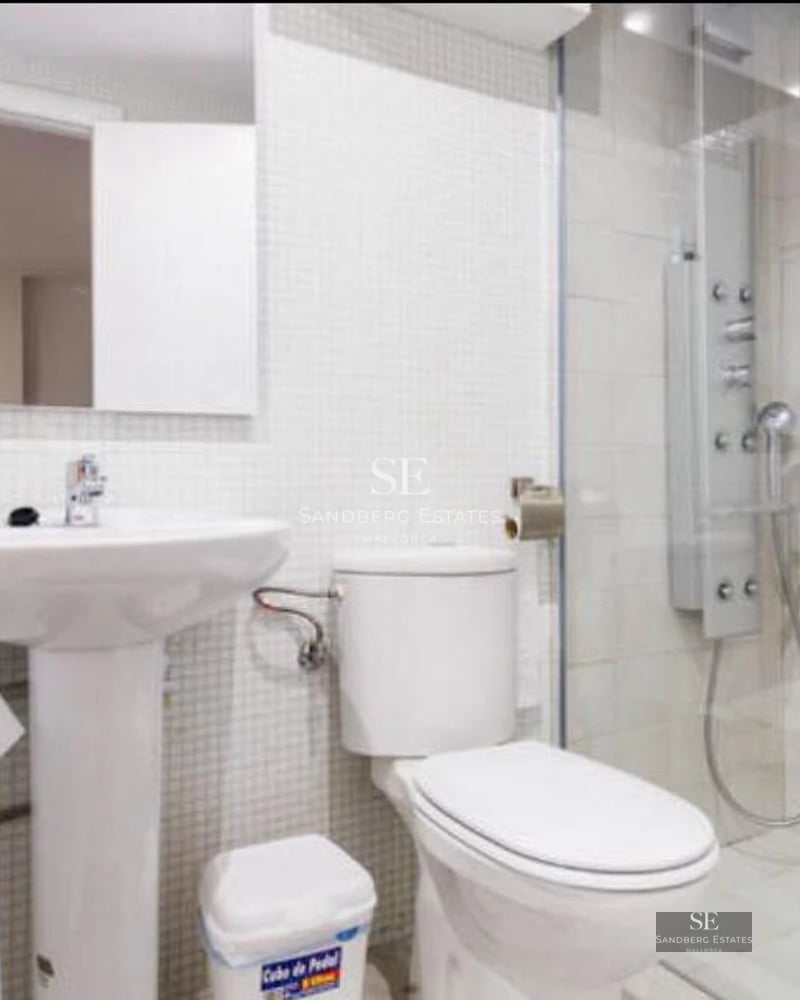 Exterior view of a modern luxury home with reflecting pool. Minimalist design featuring large windows and lush gardens.