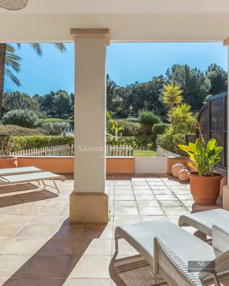 Exterior view of a modern villa featuring a swimming pool, lush garden, and minimalist architecture. Natural lighting and sleek design.