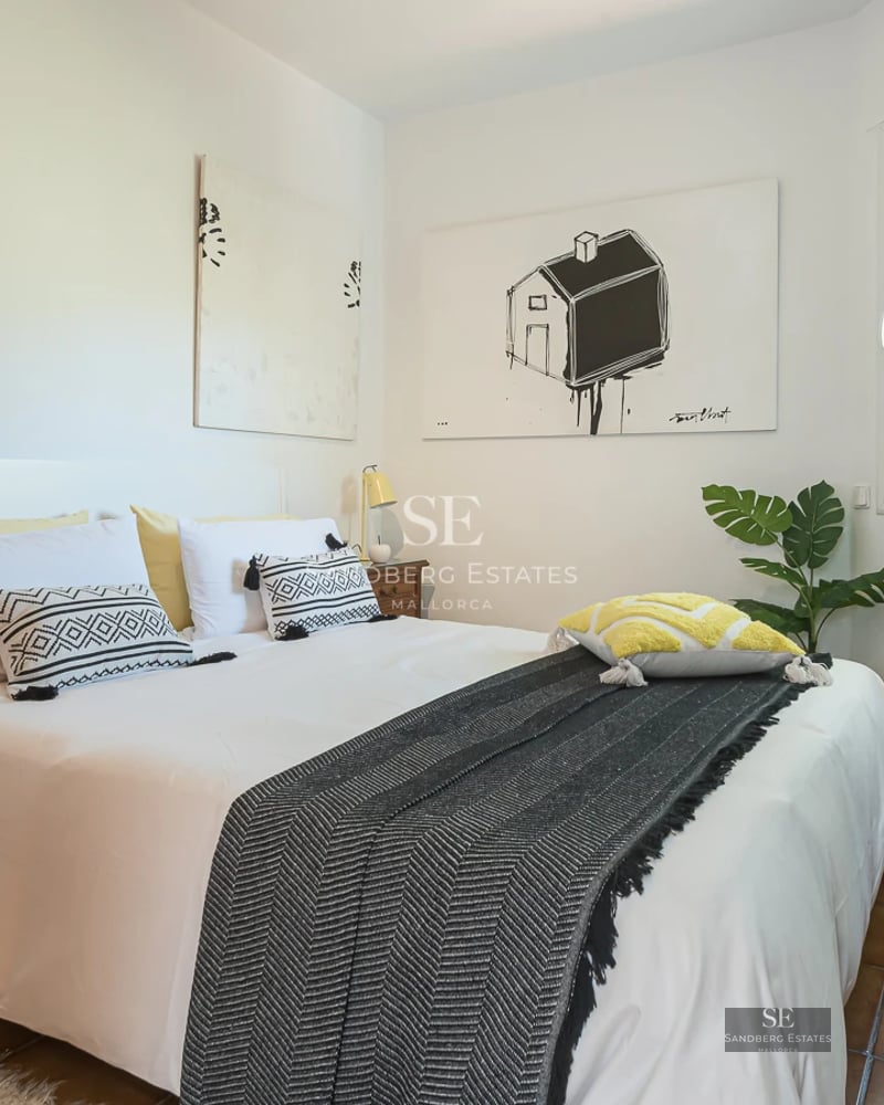 Exterior view of a luxurious home with a pool, terrace, and garden. Modern architecture with large glass windows and manicured landscaping.