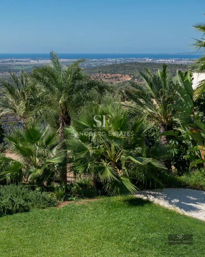 Exterior view of modern villa with infinity pool, lush garden, and spacious terraces. Minimalist architecture and elegant design.