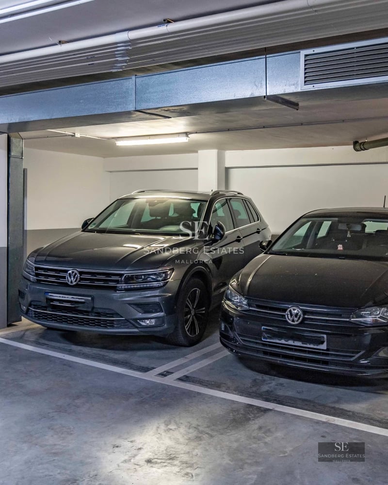 Spacious living room with panoramic sea view windows. Modern design with elegant furniture and abundant natural light.