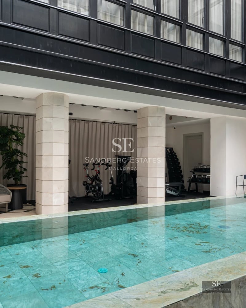 Exterior of modern villa with pool, large windows and minimalist architectural design. Lush garden and terrace.