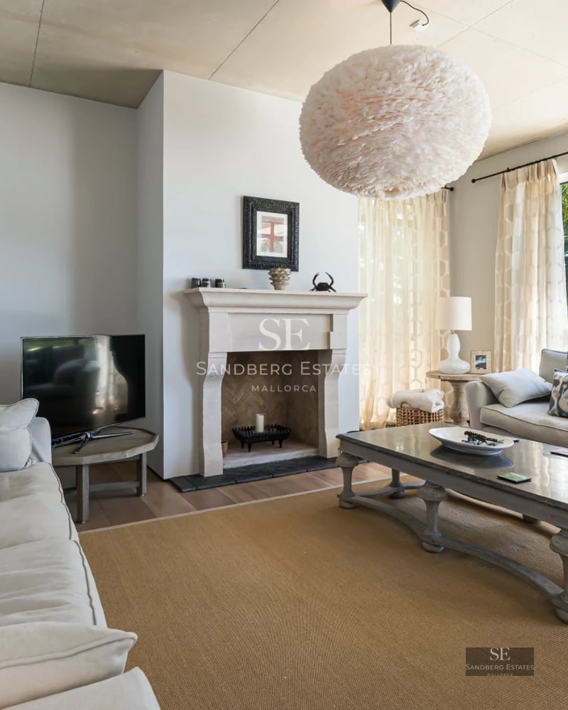 Exterior view of a modern villa featuring an infinity pool, manicured garden, and expansive terraces. Minimalist architecture with clean lines.
