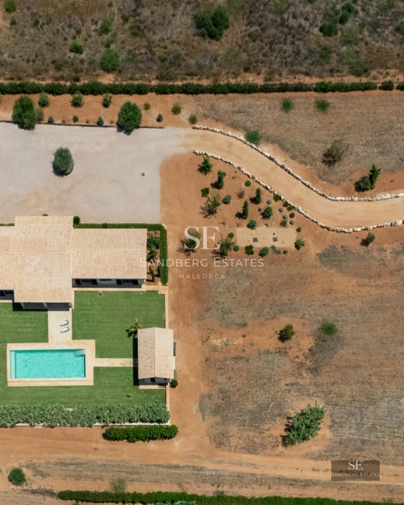 Stunning infinity pool with panoramic sea views. Modern design, expansive terrace, and lush landscaping.