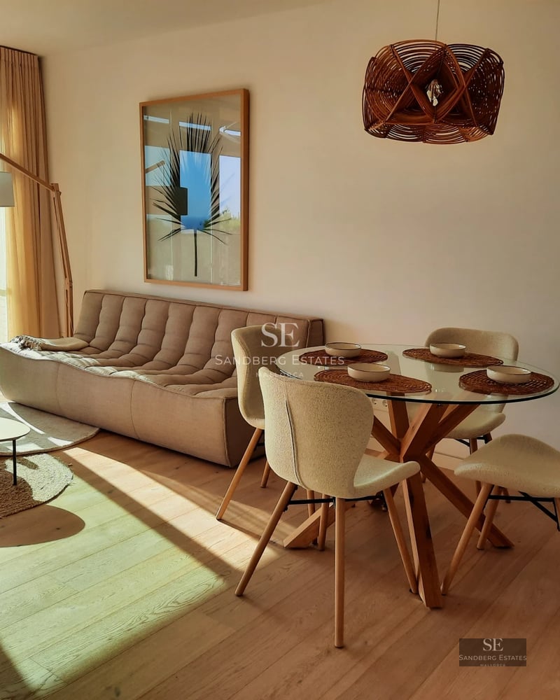 Expansive terrace with pool, lounge chairs, and view. Modern architecture featuring large windows and lush landscaping.