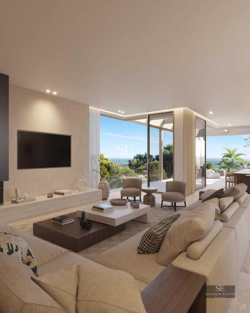 Spacious living room featuring modern fireplace, large windows, and panoramic views. Designer furniture and abundant natural light.