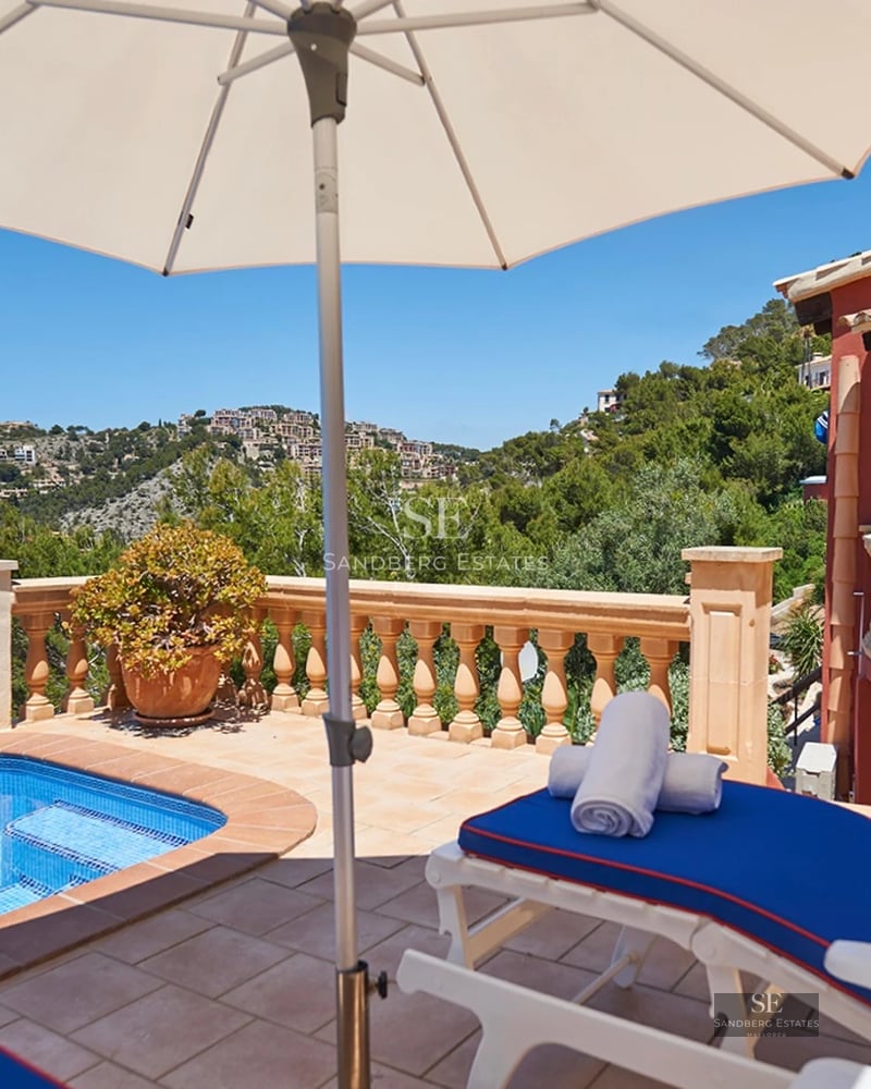 Spacious terrace with pool, sun loungers, and panoramic views. Modern design with high-quality finishes and abundant natural light.