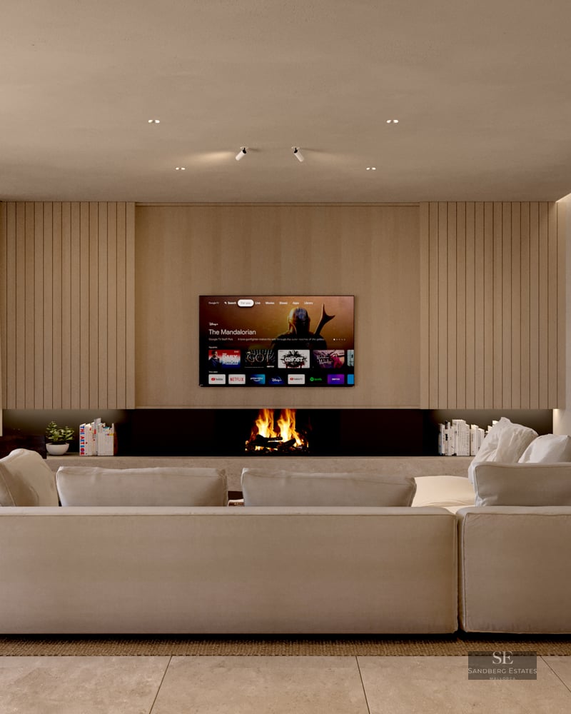 Spacious modern living room featuring a large beige sectional sofa, built-in fireplace, and wood-paneled TV wall.
