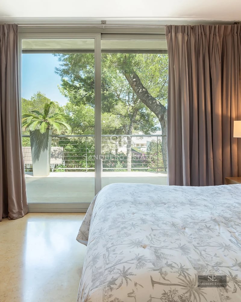 Exterior view of a luxury home with a pool, lush garden, and modern architecture. Perfect for relaxation and entertainment.