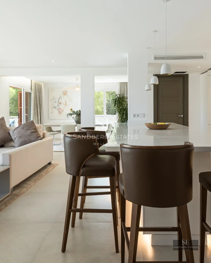 Exterior of modern villa with pool, lush garden, and minimalist architectural design. Ambient lighting and high-end finishes.