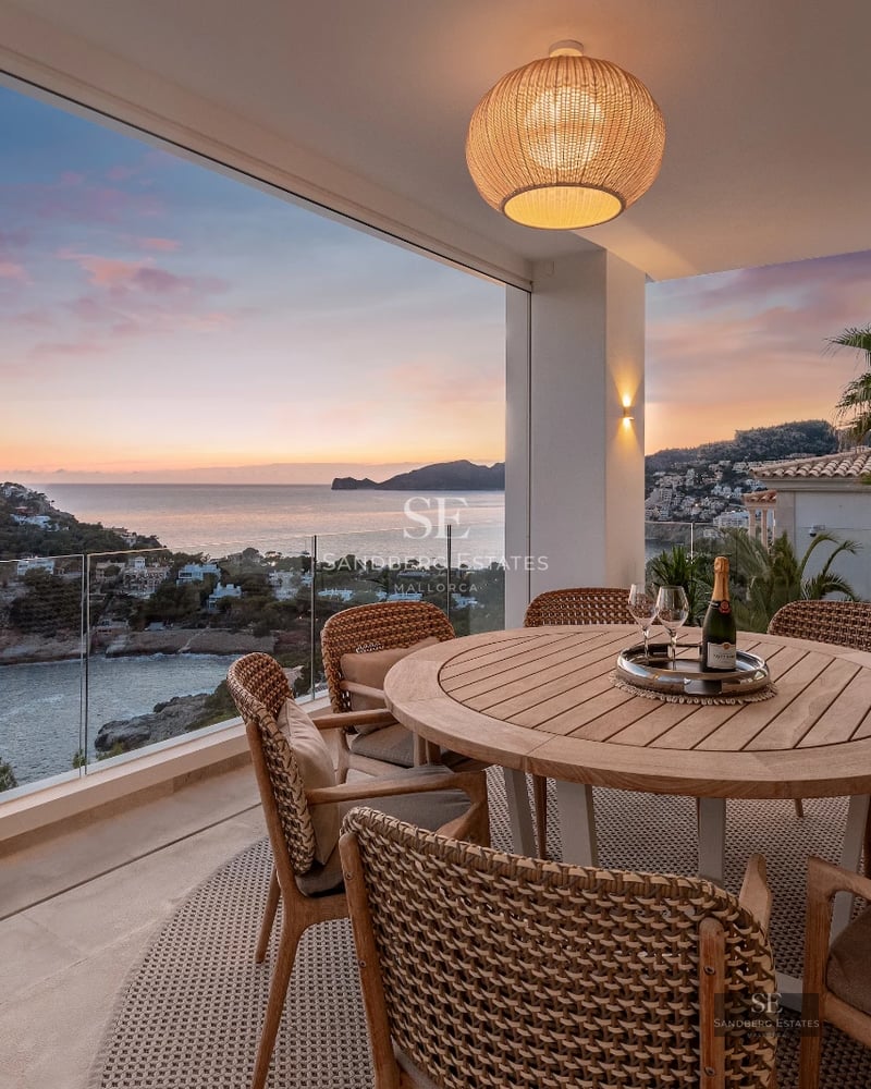 Exterior view of a modern villa with a pool, large windows, and landscaped terrace. Minimalist and elegant design.