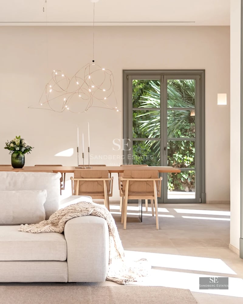 Exterior view of a modern villa with reflecting pool, surrounded by lush greenery. Sleek and contemporary architectural design.