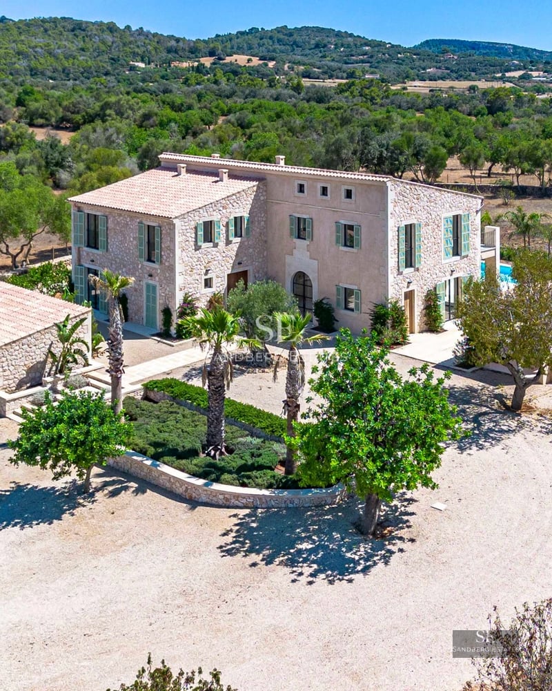 Terrace with panoramic sea views. Modern design, glass railing, elegant furniture and lush vegetation.