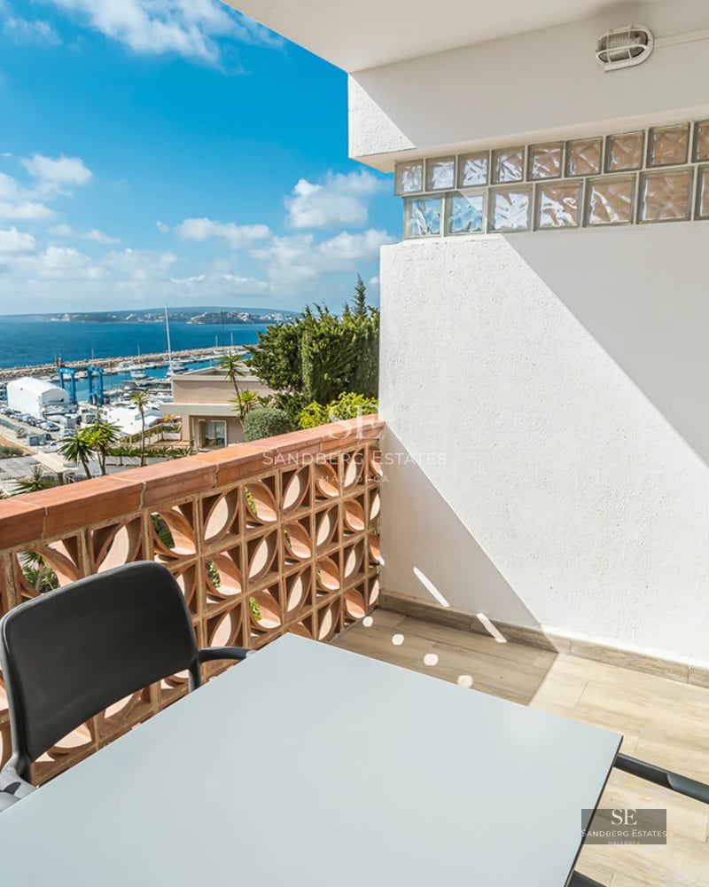 Spacious living room with panoramic views. Minimalist interior, abundant natural light, modern fireplace, and designer furniture.
