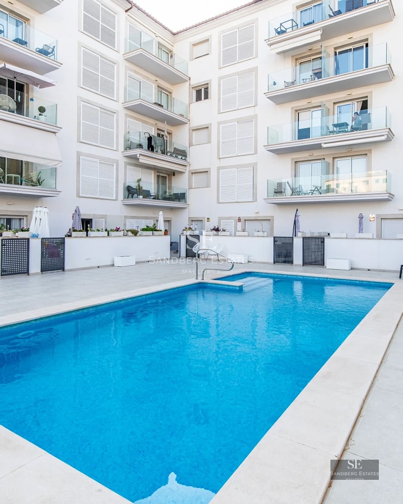 Exterior of modern home with pool. Minimalist design, large windows, lush greenery. Soft lighting.