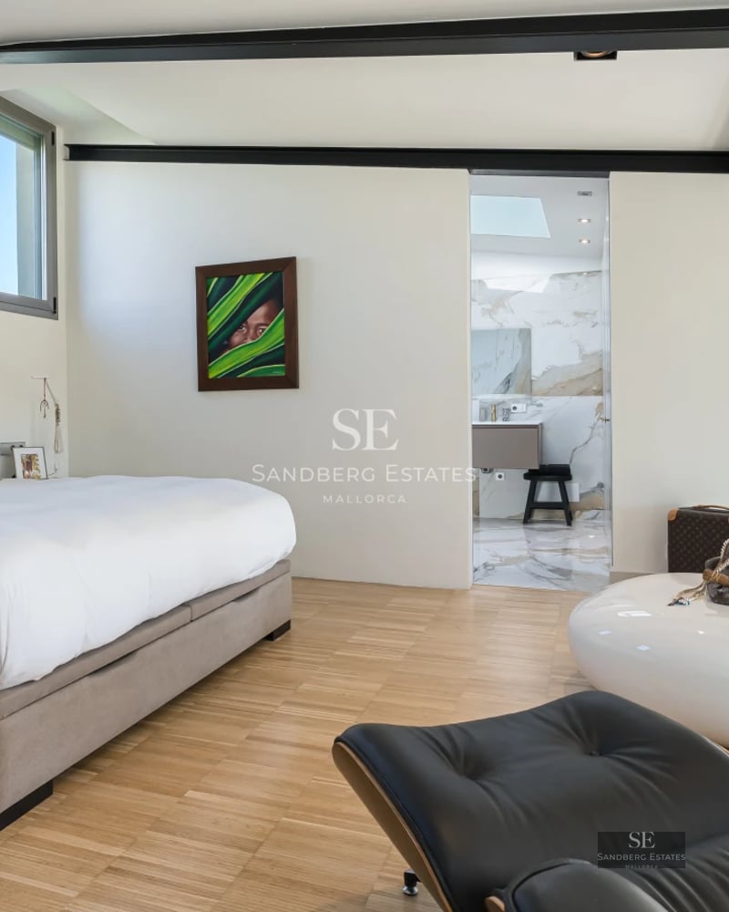 Modern villa featuring an infinity pool, lounge chairs, and lush garden. Minimalist architecture, large windows, and elegant design.