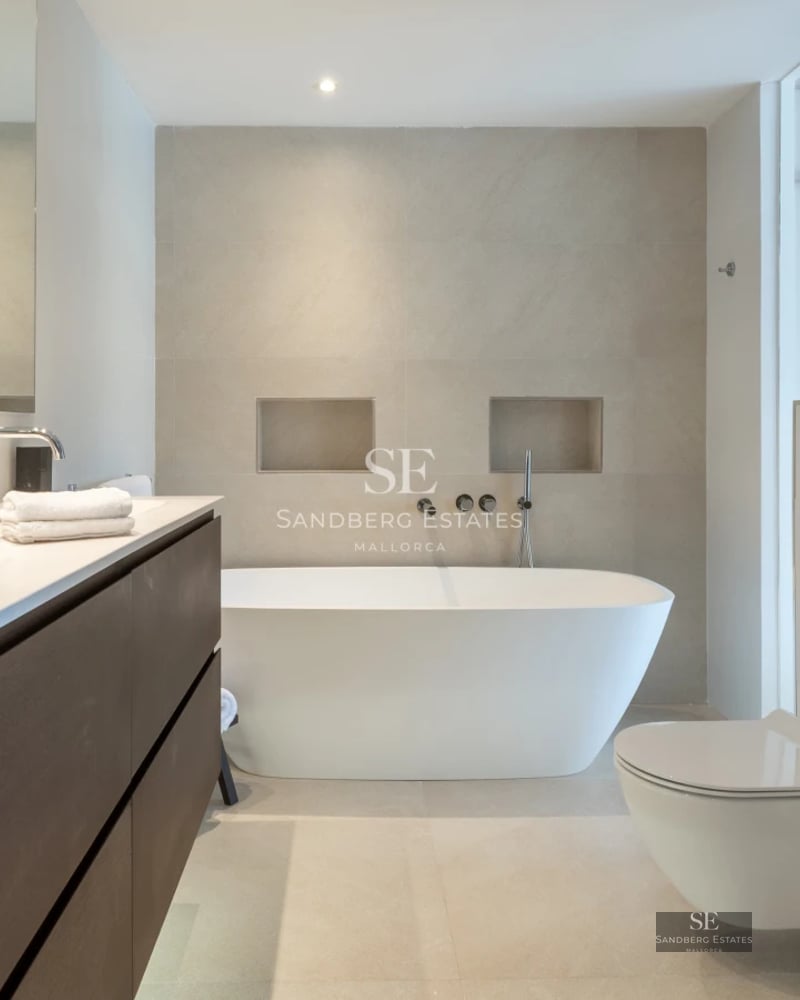 View of a luxury villa with infinity pool, spacious terrace and panoramic sea views. Modern architecture, elegant design.