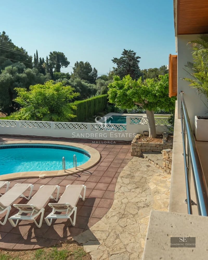 Expansive terrace with pool, sun loungers, and stunning views. Modern design, natural lighting, and luxurious details.