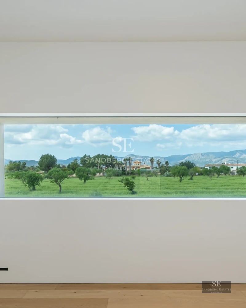 Exterior view of a modern villa with infinity pool, manicured garden, and spacious terraces. Minimalist and elegant architecture.