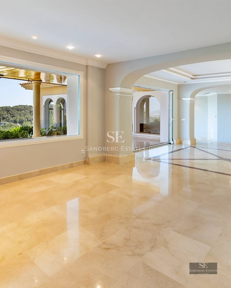 Exterior view of a modern villa featuring a pool, garden, and expansive windows. Minimalist design and manicured landscaping.
