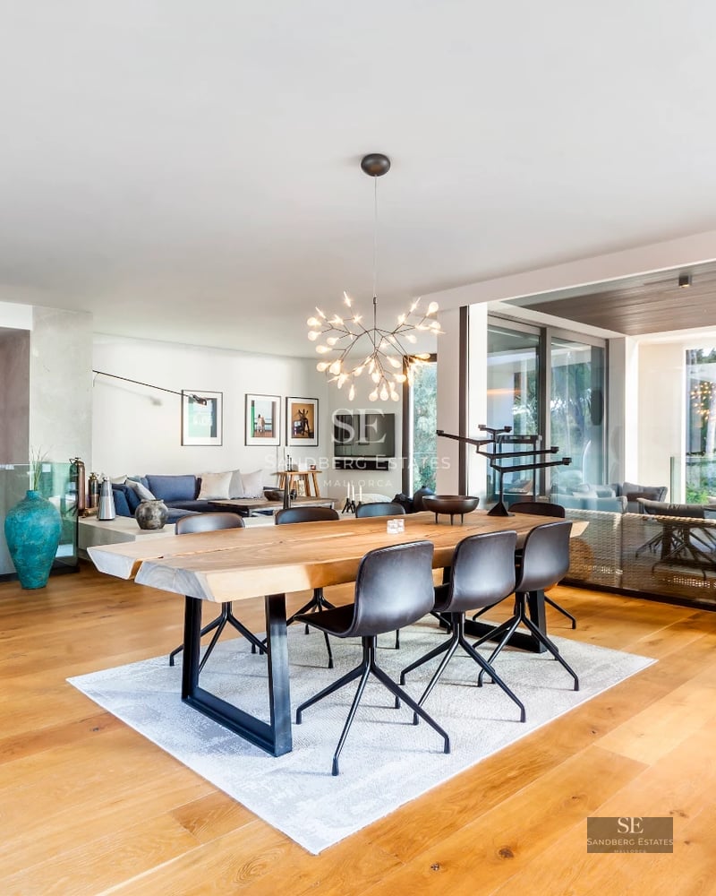 Spacious terrace with infinity pool, modern furniture and panoramic views. Minimalist and elegant design. Natural lighting.