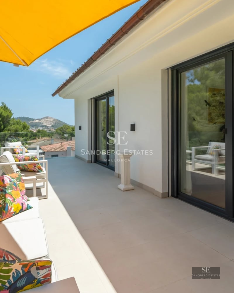 Exterior of a modern villa featuring a reflective pool. Showcases minimalist architecture, expansive windows, and elegant landscaping.