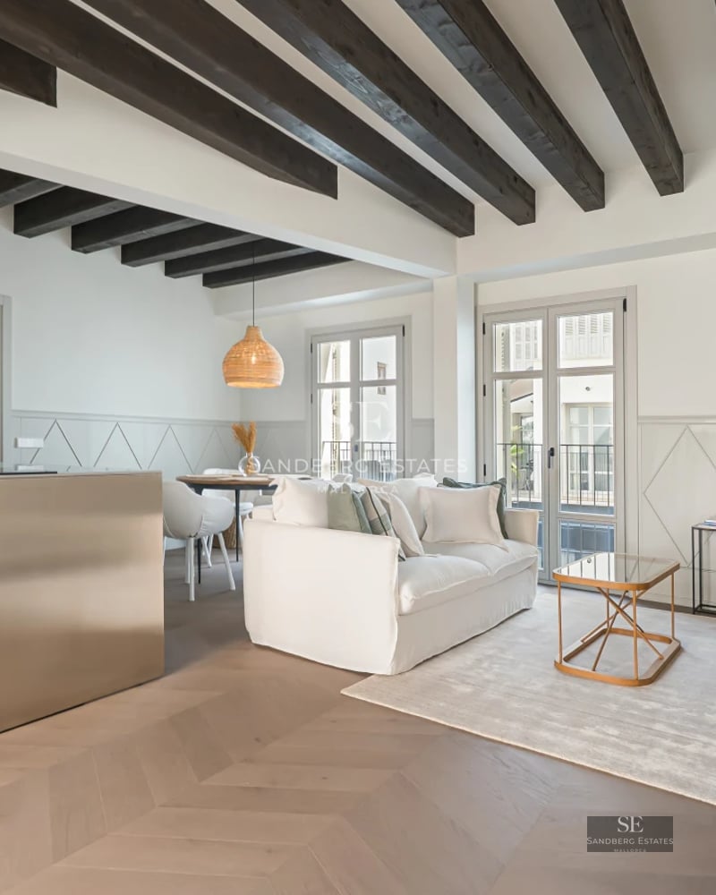 Exterior view of a modern villa with pool, large windows, covered terrace, and lush garden. Contemporary architecture and manicured landscaping.