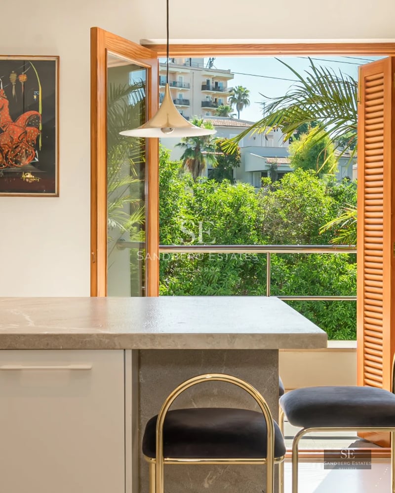 Exterior view of a modern villa with a pool, landscaped garden, and spacious terraces. Minimalist and elegant architectural design.