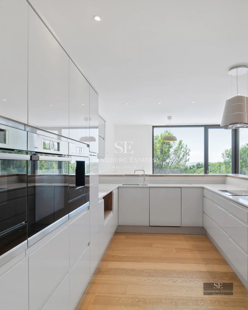 Exterior view of a modern villa with pool and lush garden. Minimalist architecture, large windows, and high-quality finishes.
