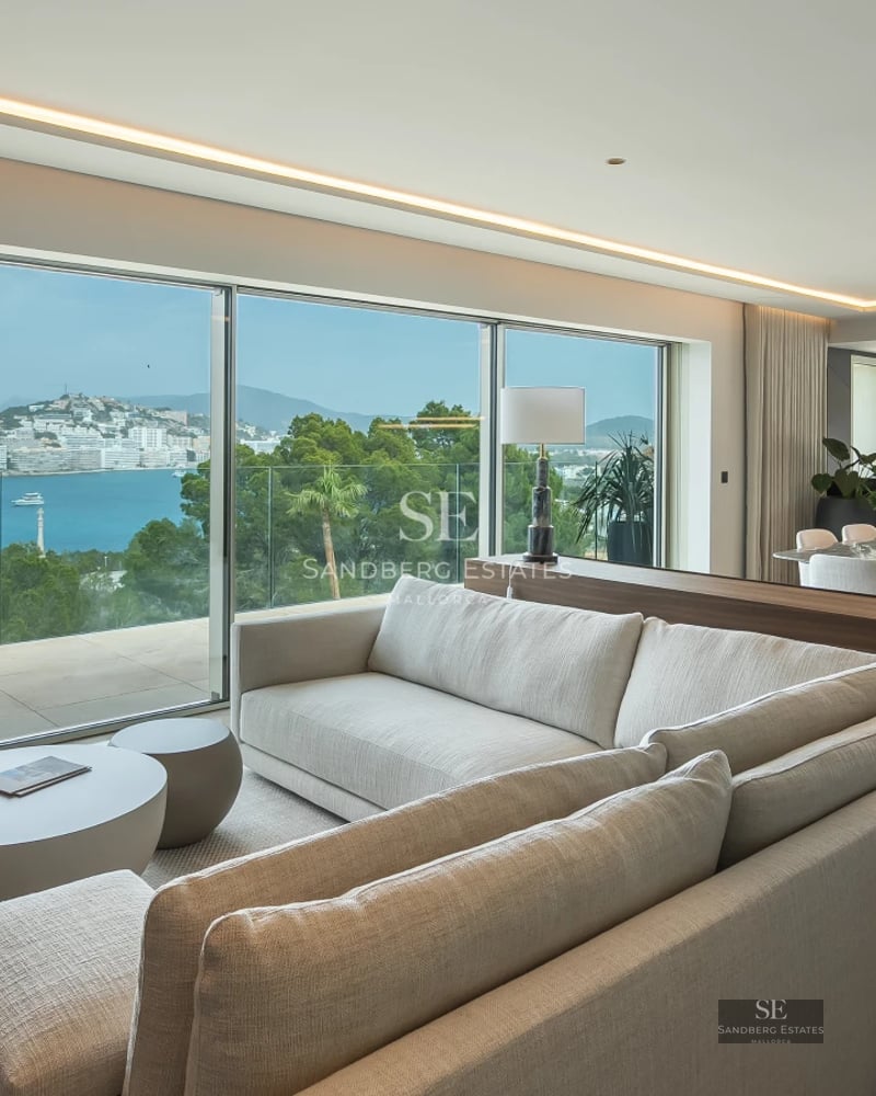 Spacious terrace with infinity pool, panoramic views, modern outdoor furniture, and lush greenery. Minimalist architecture.