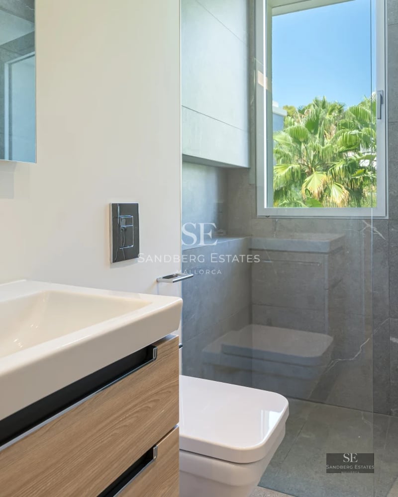 Spacious balcony with pool and breathtaking views. Modern design, glass railing and wooden floor. Luxury and comfort.