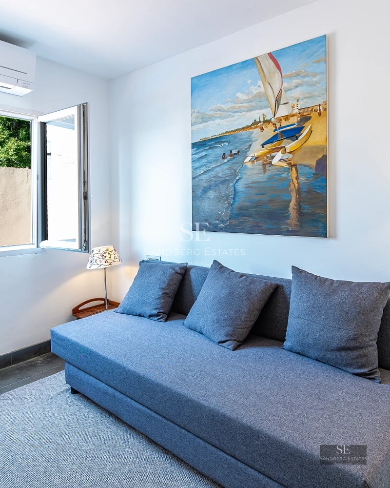 Exterior view of a modern villa with swimming pool, garden, and terrace. Minimalist architecture, large windows, and high-quality finishes.