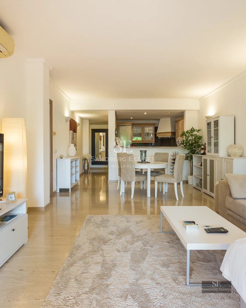 Spacious terrace featuring an infinity pool, sun loungers, panoramic views, and modern architecture. Elegant and relaxing design.