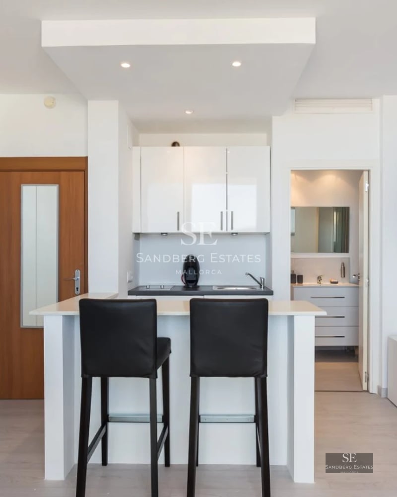 Exterior of modern villa featuring an infinity pool, lush gardens, and panoramic views. Minimalist architecture with expansive windows.