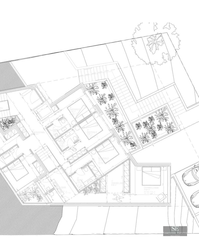 Exterior view of a modern villa with an infinity pool, surrounded by lush greenery and spacious terraces.