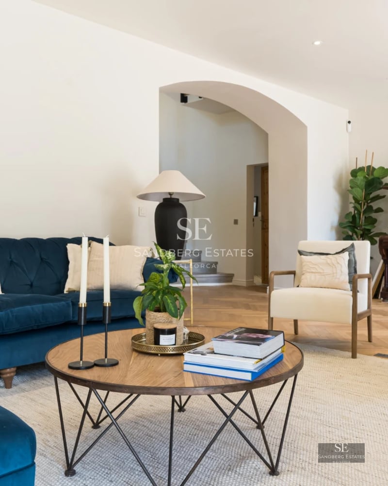 Spacious living room with large windows and panoramic sea views. Modern and bright design with balcony. Designer furniture.